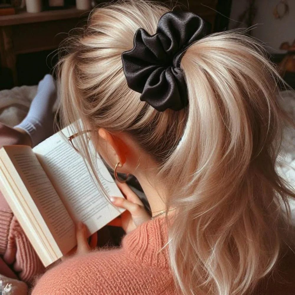 Unleash the fun with our versatile scrunchies!  These ultra-soft hair ties are your go-to for comfortable hold and effortless style.