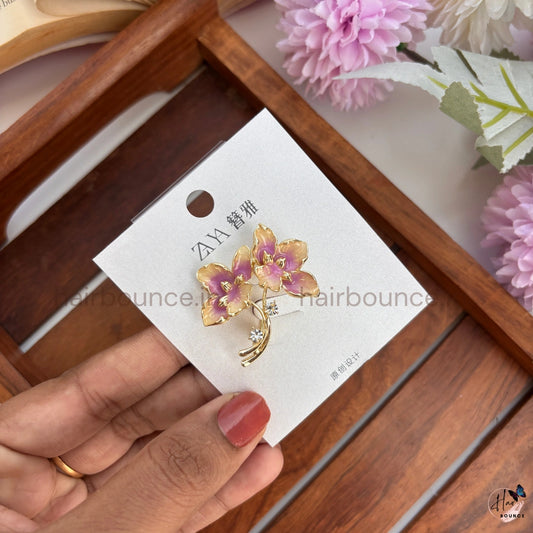 Elegant Gold Floral Brooch with Crystal Accent