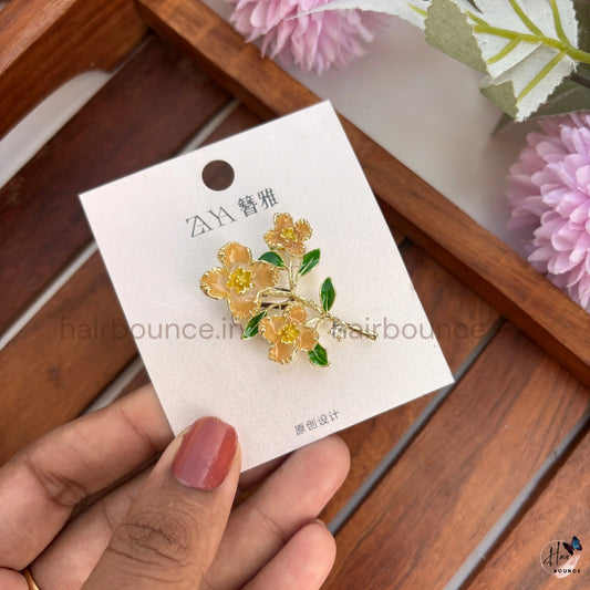 Gold Floral Brooch with Green Leaves & Crystal Drop